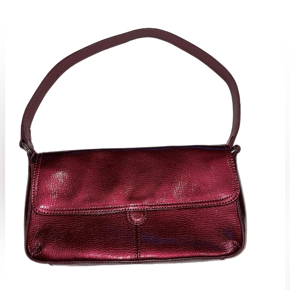 HOBO international handbag in a metallic wine with gold interior colorway. O